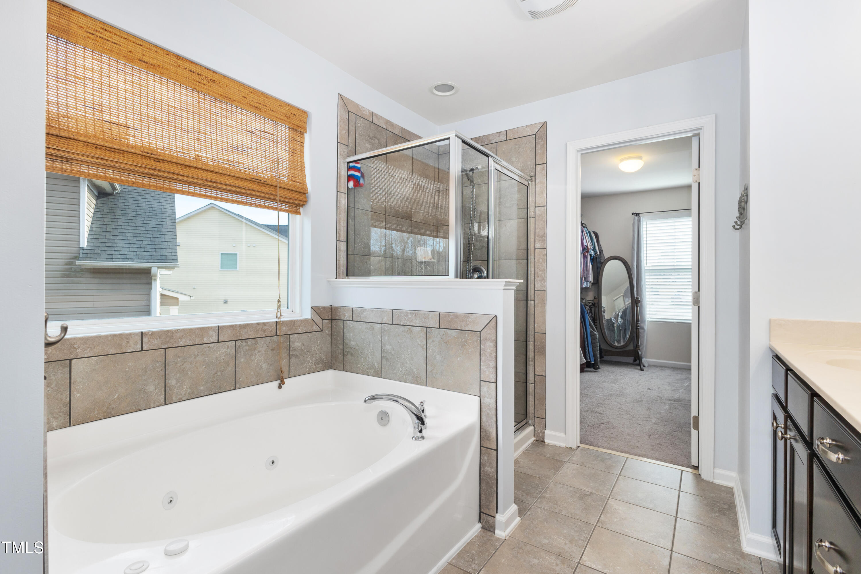 617 Hope Valley Road Knightdale, NC 27545 - Photo 19 of 42 a bathroom with a bathtub and a shower