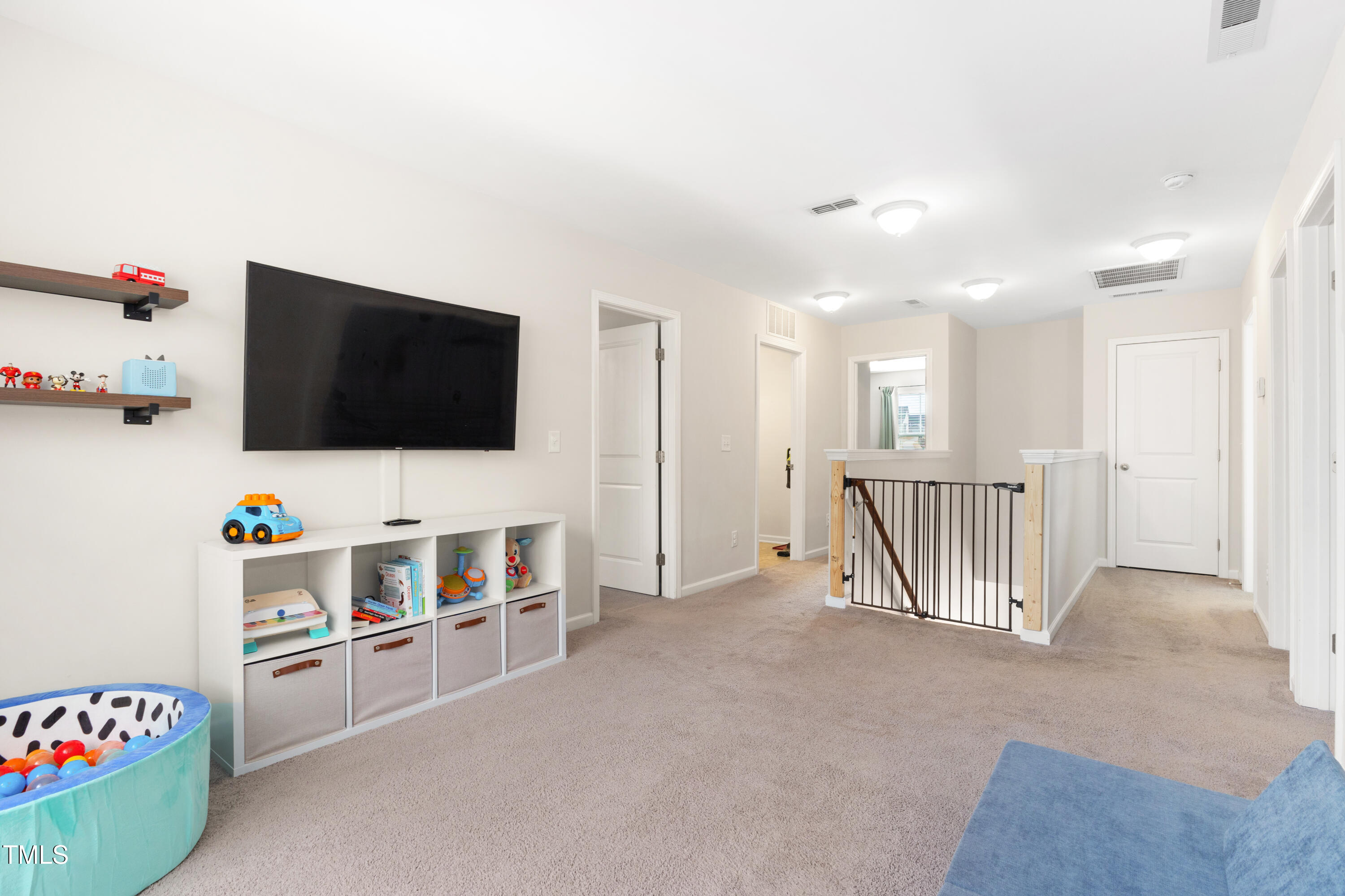 617 Hope Valley Road Knightdale, NC 27545 - Photo 22 of 42 a view of a livingroom with furniture and a flat screen tv