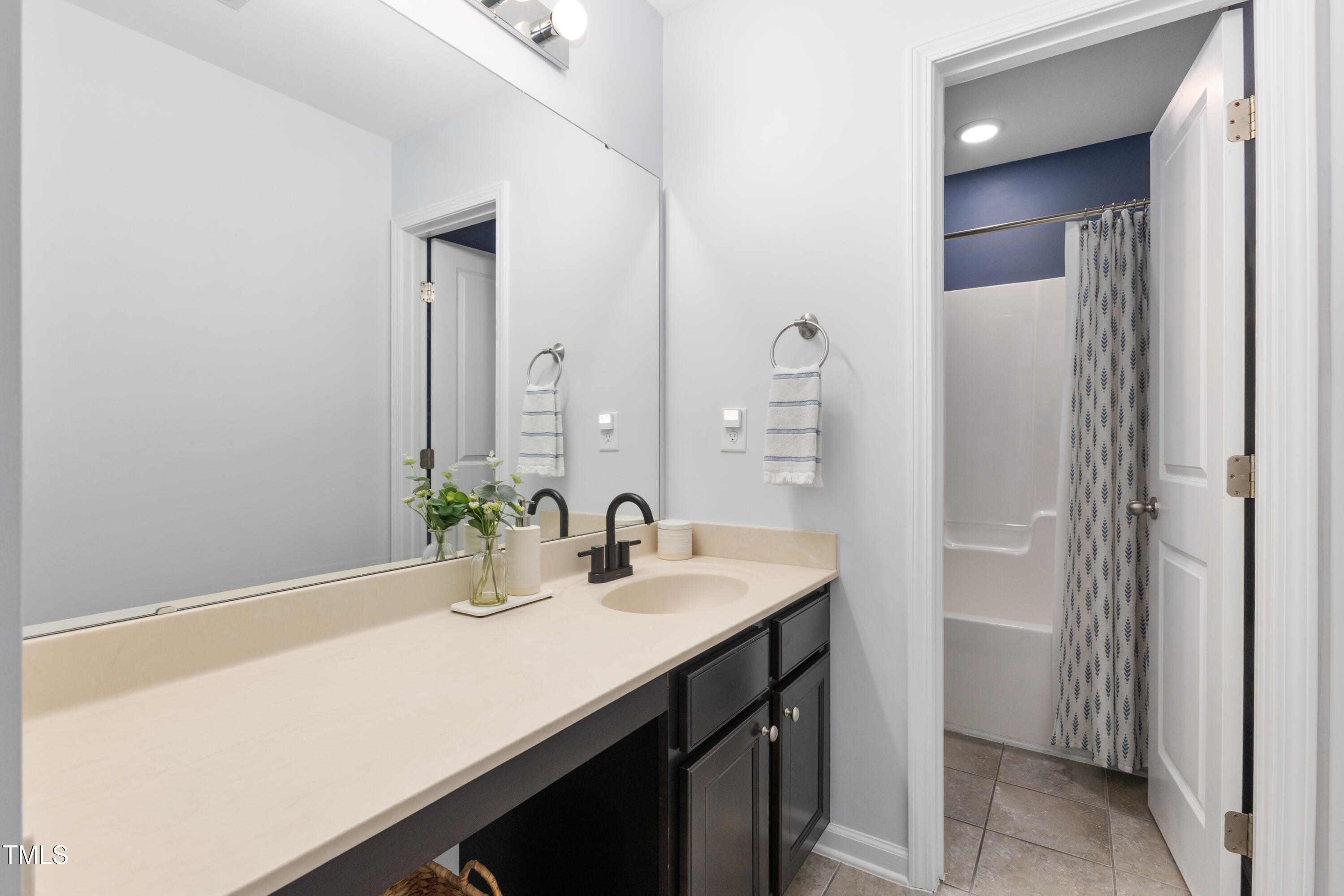 617 Hope Valley Road Knightdale, NC 27545 - Photo 25 of 42 a bathroom with a sink and a mirror