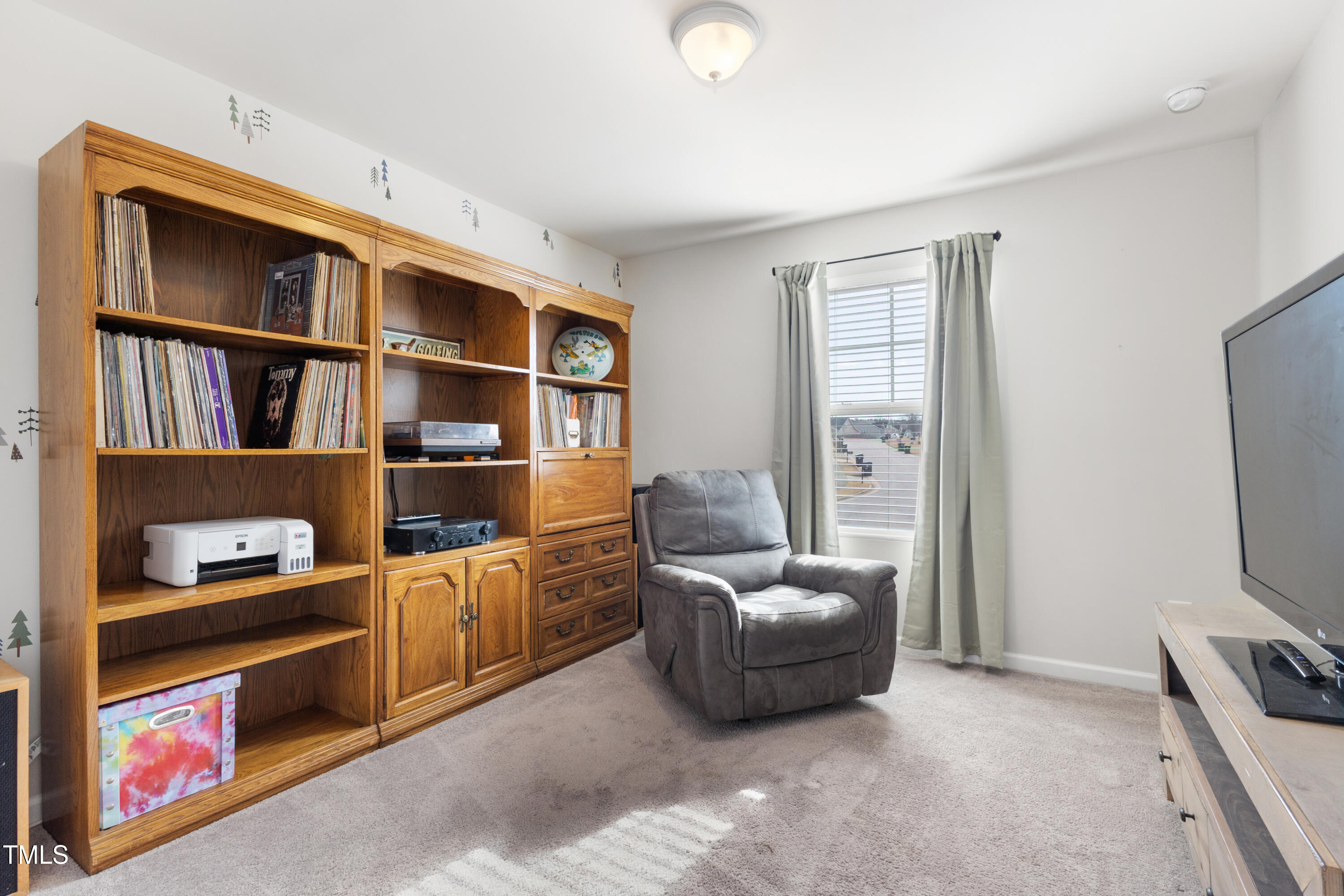 617 Hope Valley Road Knightdale, NC 27545 - Photo 27 of 42 a view of living room with furniture and flat screen tv