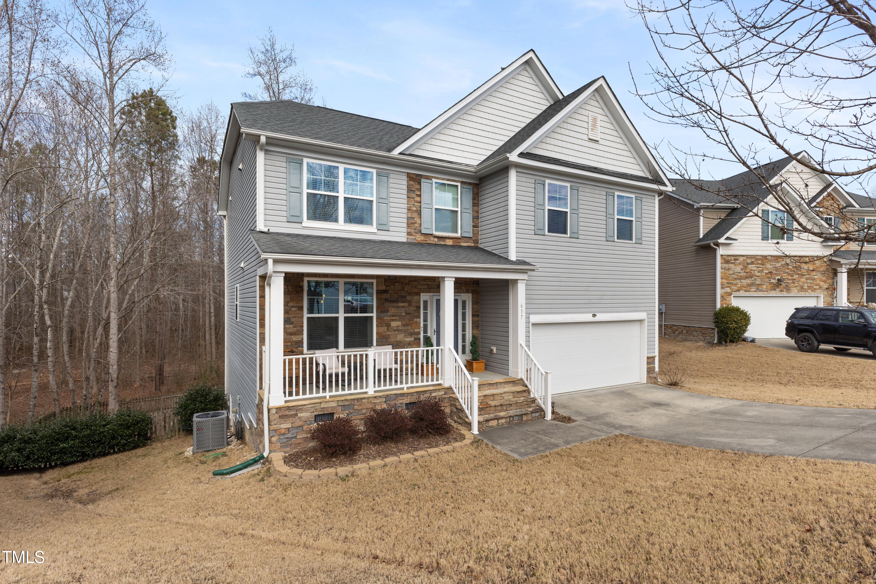 617 Hope Valley Road Knightdale, NC 27545 - Photo 2 of 42 a front view of a house with a yard and garage