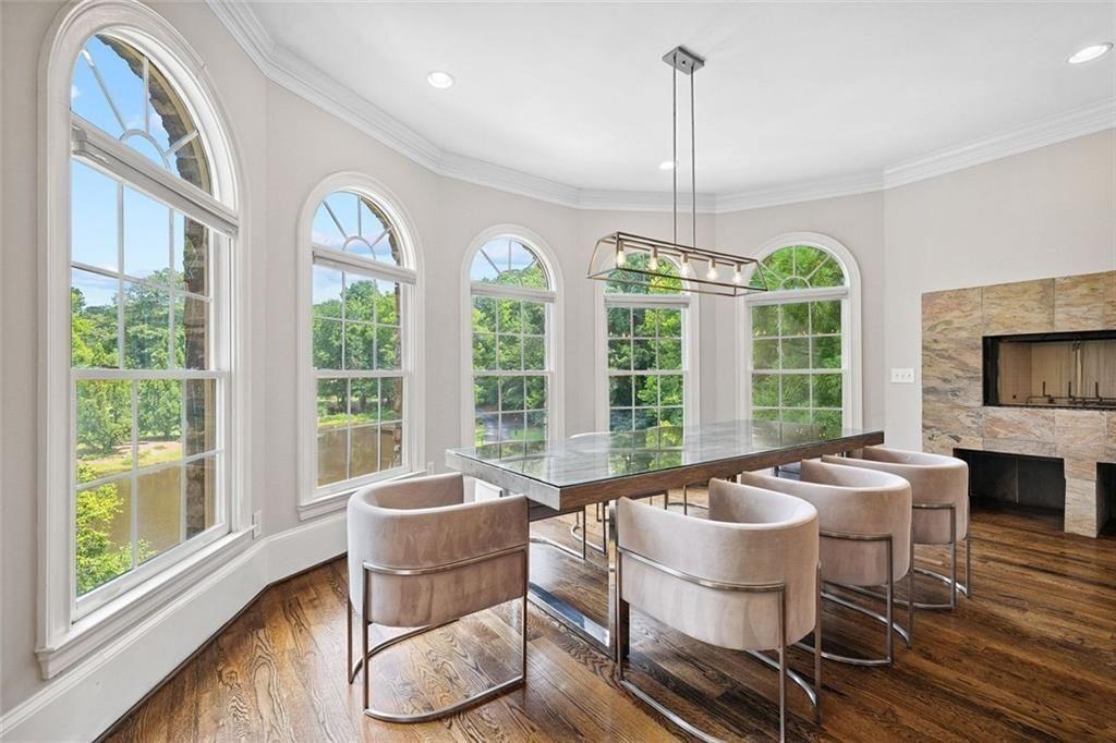 11140 W Road Roswell, GA 30075 - Photo 19 of 72 a living room with furniture a flat screen tv and a large window