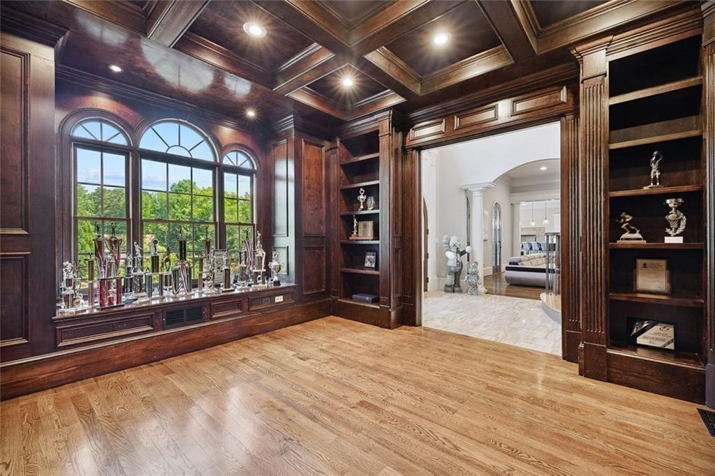 11140 W Road Roswell, GA 30075 - Photo 21 of 72 a view of an empty room with wooden floor and a window