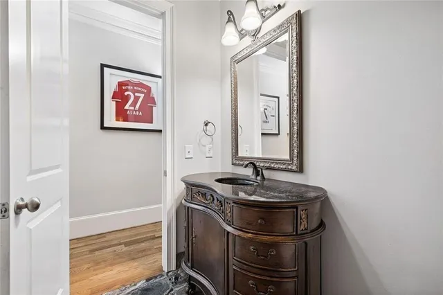 a spacious bathroom with sinks granite countertop tub a double vanity sink a window and a mirror