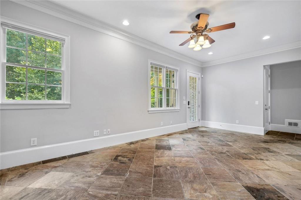 11140 W Road Roswell, GA 30075 - Photo 27 of 72 a view of an empty room with a window