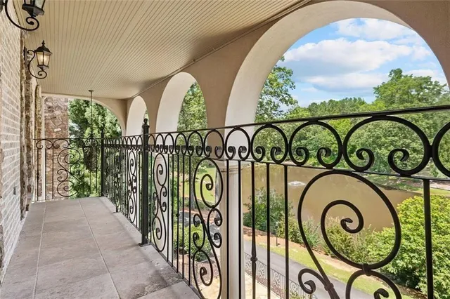 a living room with lots of furniture and a chandelier