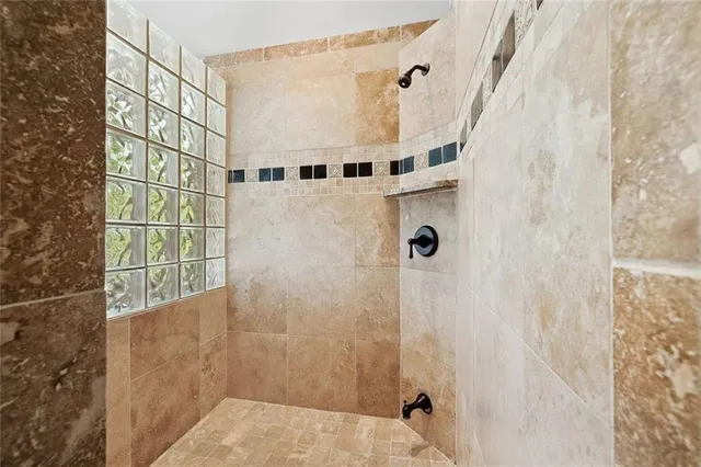 a view of a patio with chairs and a table