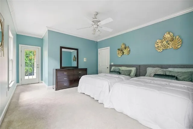 a bathroom with a granite countertop sink a toilet a mirror and shower