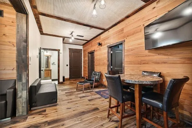 an aerial view of a house with a yard and lake view