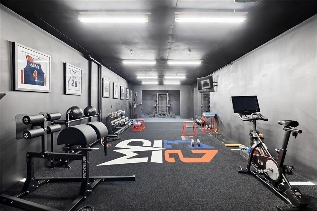 11140 W Road Roswell, GA 30075 - Photo 51 of 72 a room with gym equipment and a large window