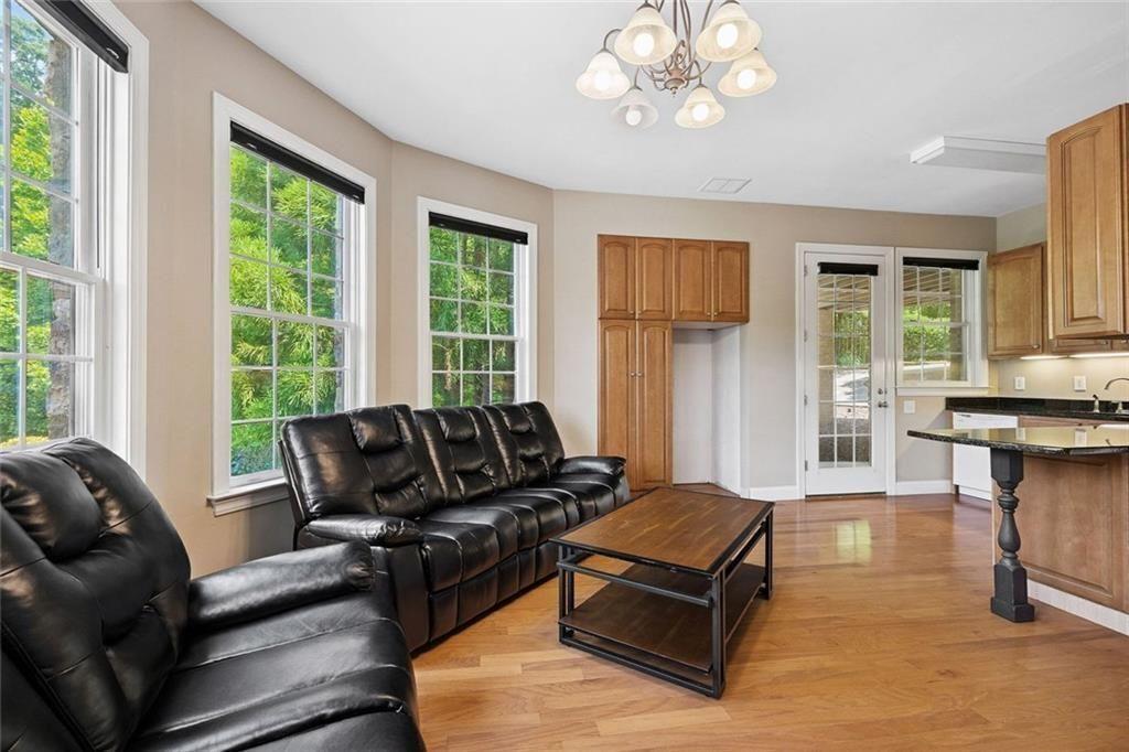 11140 W Road Roswell, GA 30075 - Photo 52 of 72 a living room with furniture and a large window