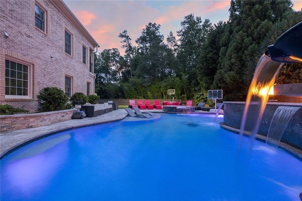 11140 W Road Roswell, GA 30075 - Photo 66 of 72 a swimming pool with outdoor seating and yard