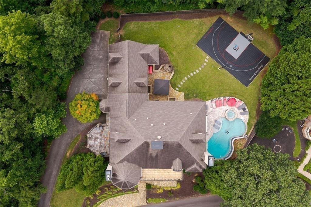 11140 W Road Roswell, GA 30075 - Photo 69 of 72 an aerial view of a house with a swimming pool and outdoor seating