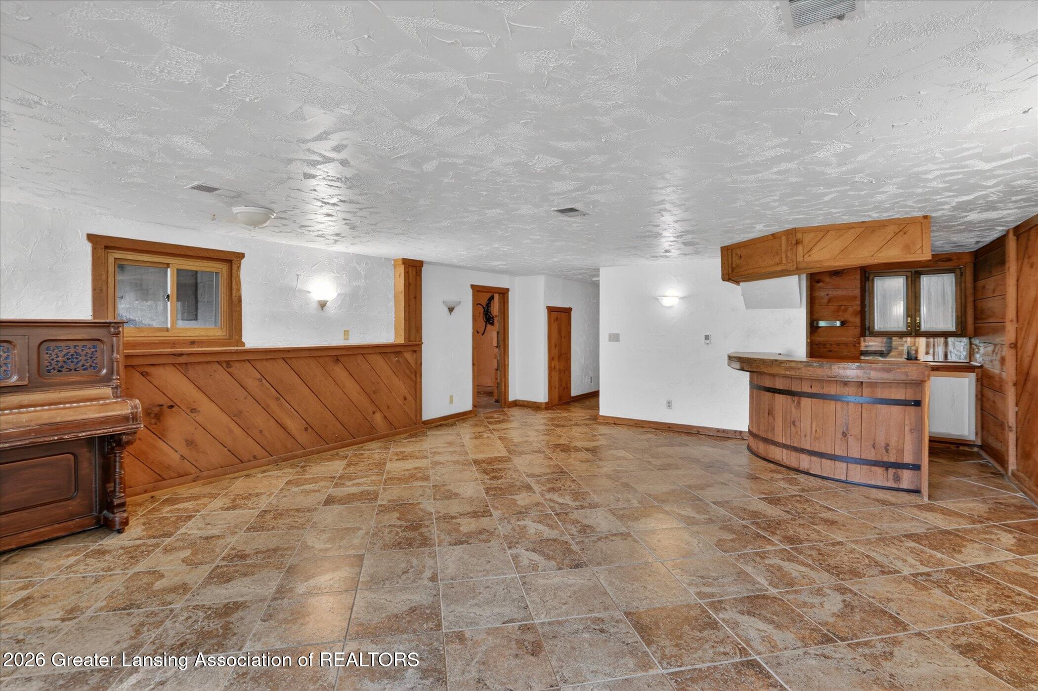 12830 Upton Road Bath, MI 48808 - Photo 27 of 38 Basement Family Room