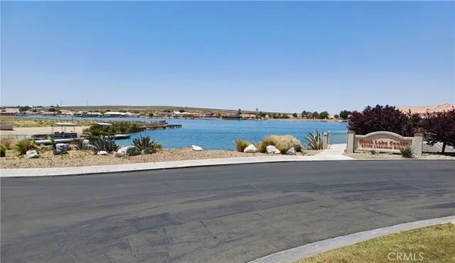 an aerial view of a house with a lot of mountains