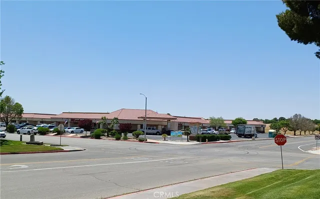 a view of a city street and car parked
