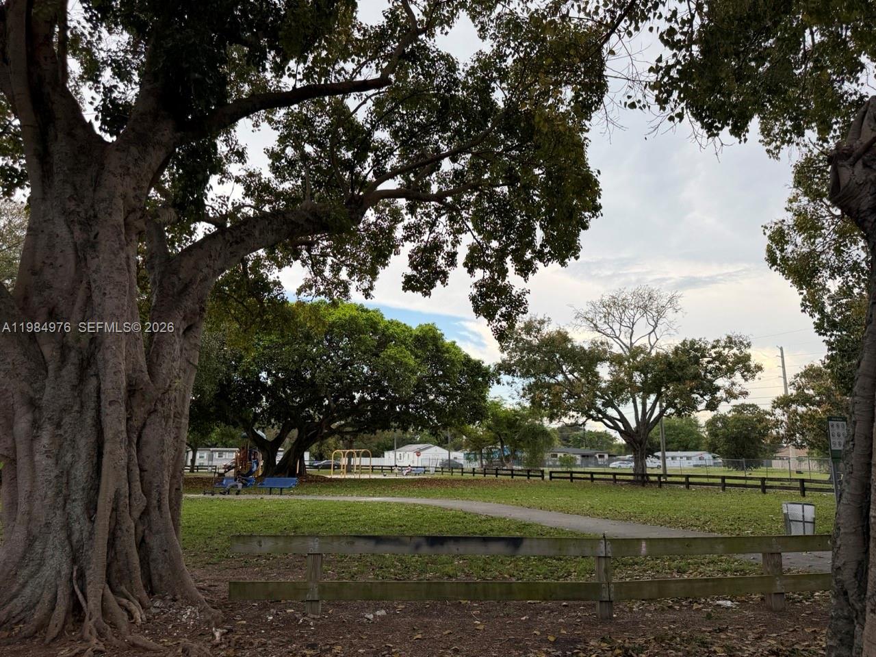 2335 Northwest 68th Street, Unit 1 Miami, FL 33147 - Photo 6 of 12 a big yard with large trees