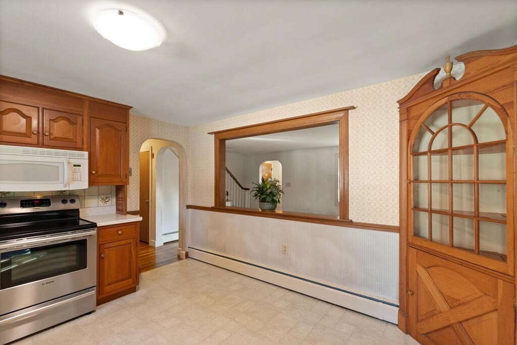 16 Surrey Road Salem, MA 01970 - Photo 18 of 32 a view of a kitchen with furniture and electronic appliances