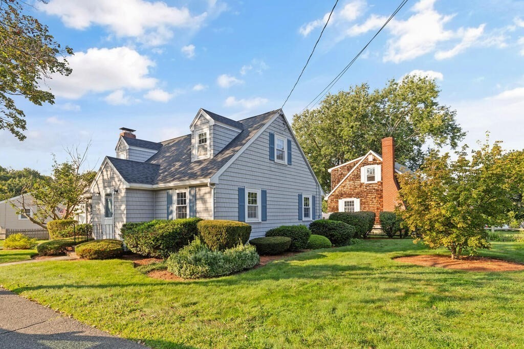 16 Surrey Road Salem, MA 01970 - Photo 2 of 32 a front view of a house with a yard