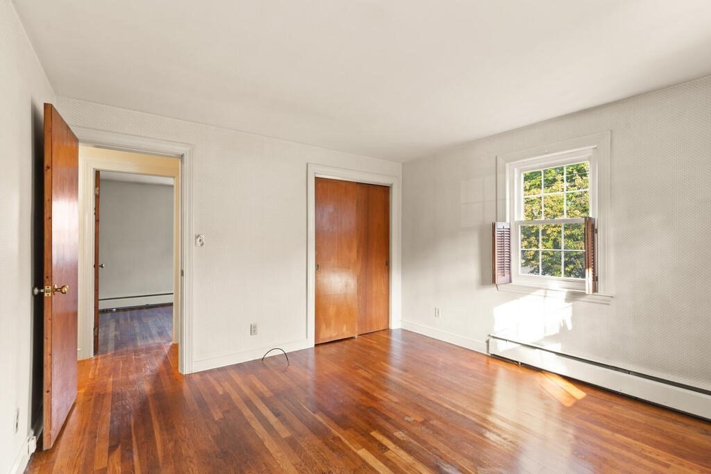16 Surrey Road Salem, MA 01970 - Photo 24 of 32 a view of an empty room with wooden floor and a window