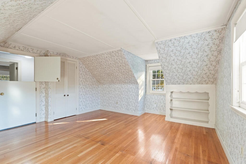 16 Surrey Road Salem, MA 01970 - Photo 26 of 32 a view of empty room with wooden floor and window