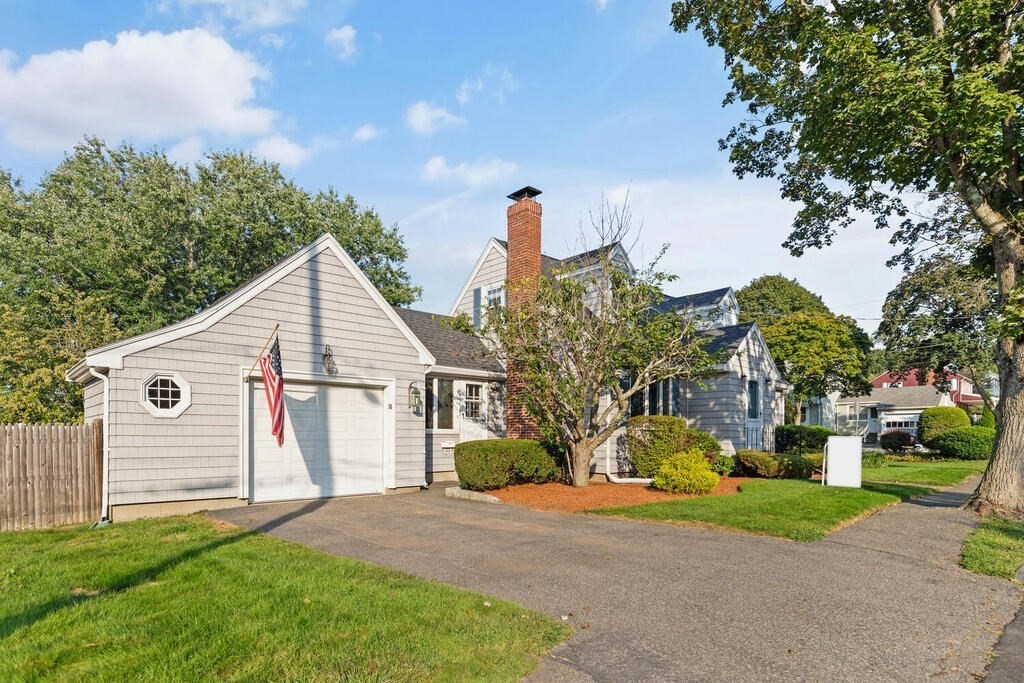 16 Surrey Road Salem, MA 01970 - Photo 3 of 32 a view of a house with a yard and a garden