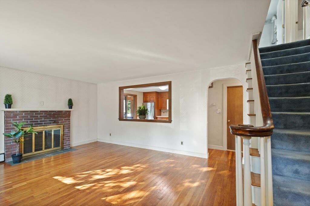 16 Surrey Road Salem, MA 01970 - Photo 8 of 32 a view of livingroom with furniture fireplace and workspace