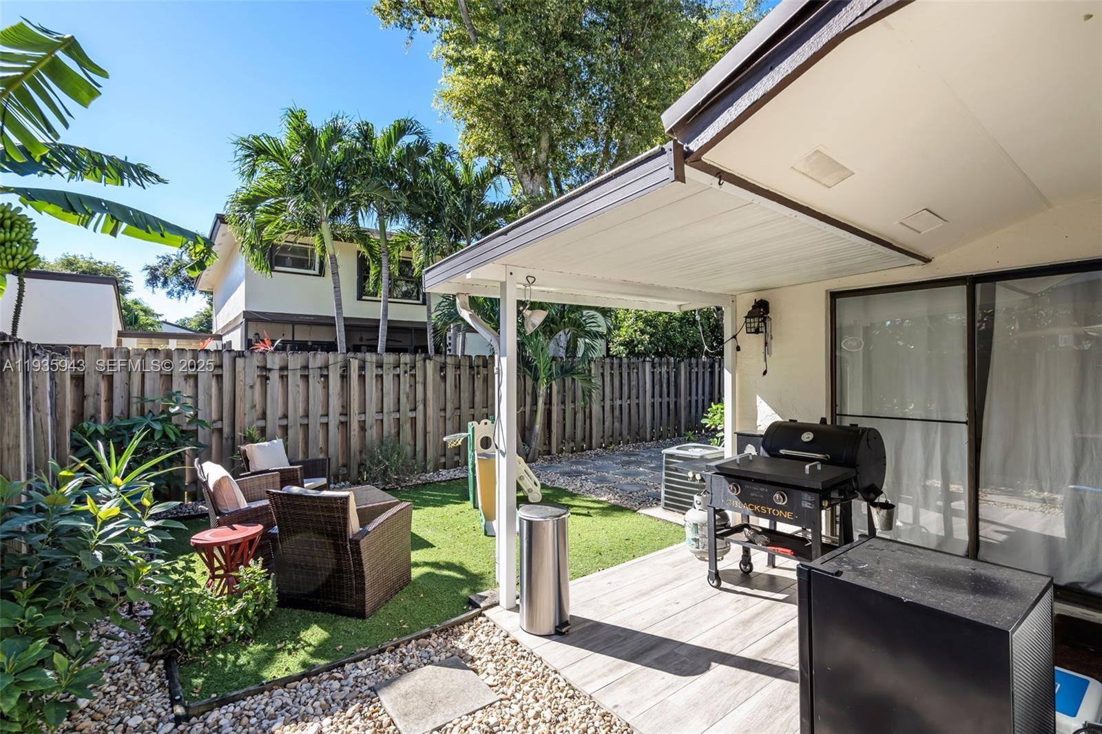 12950 Southwest 66th Terrace, Unit 12950 Miami, FL 33183 - Photo 11 of 16 a view of a patio with chairs and plants