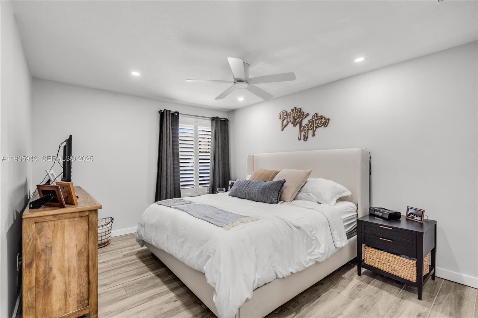 12950 Southwest 66th Terrace, Unit 12950 Miami, FL 33183 - Photo 7 of 16 a bedroom with a bed and a rug