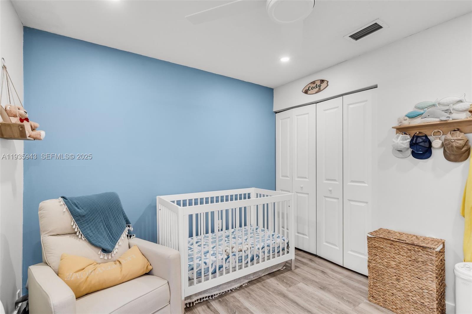 12950 Southwest 66th Terrace, Unit 12950 Miami, FL 33183 - Photo 9 of 16 a view of a bedroom with furniture and wooden floor