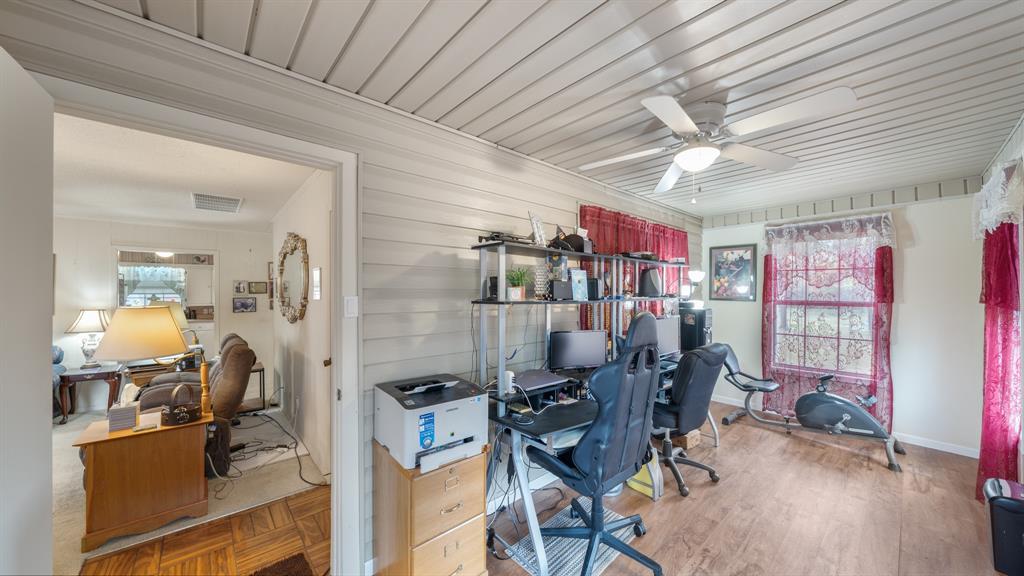 460 VZ County Road Canton, TX 75103 - Photo 8 of 24 Home office with healthy amount of natural light, wood walls, and a ceiling fan