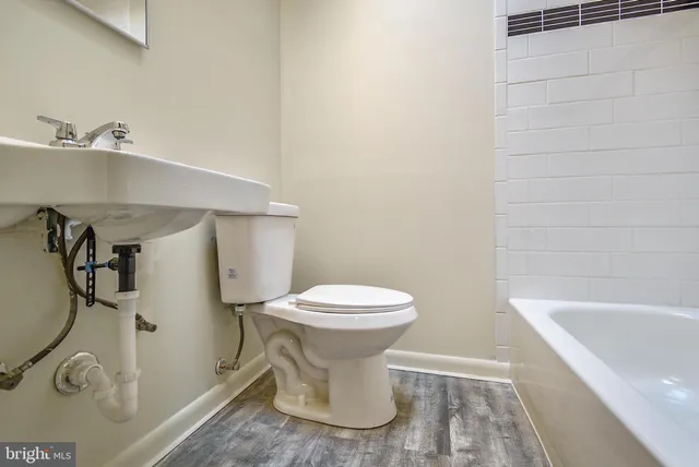 a bathroom with a toilet and a sink