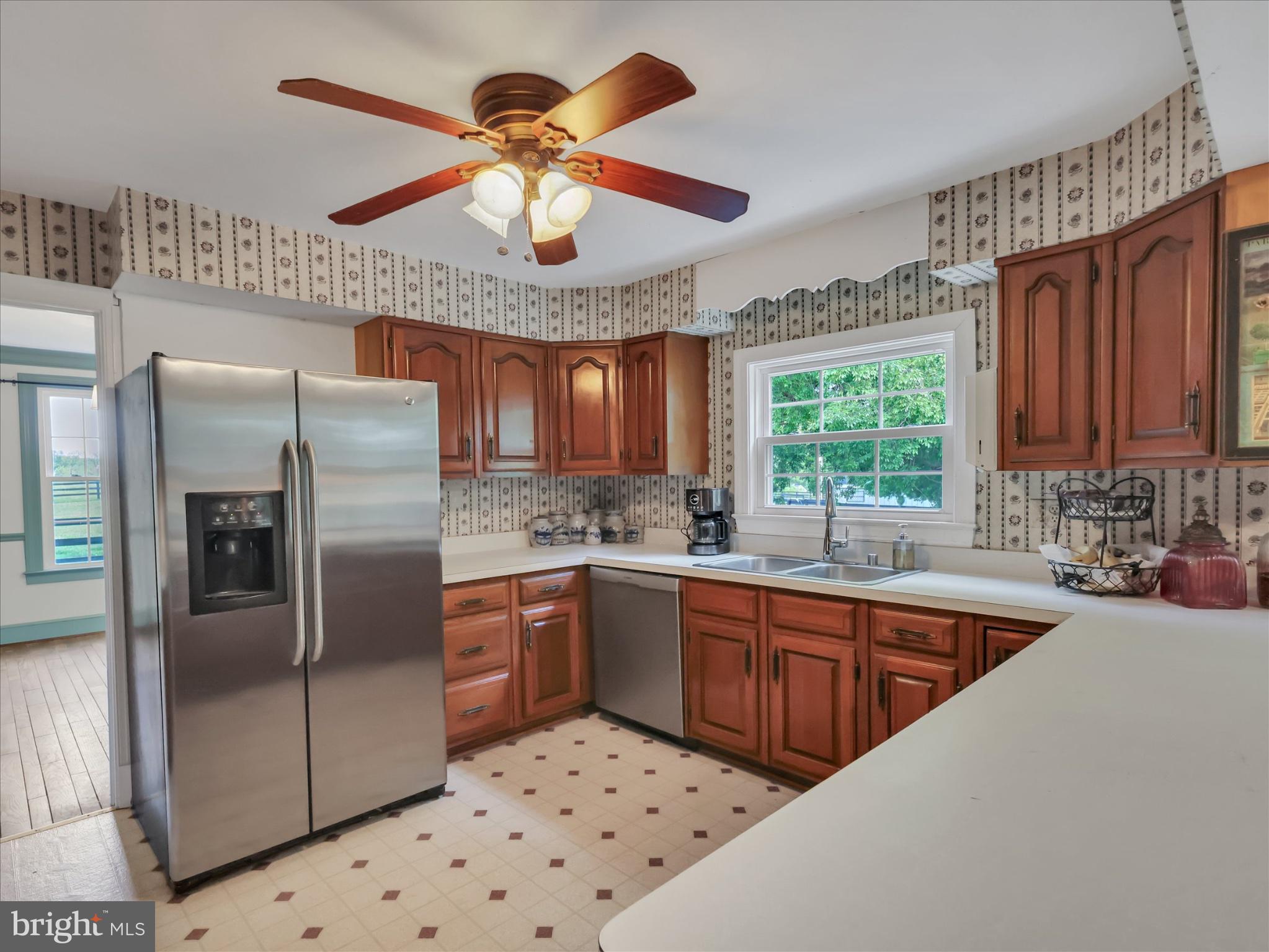 19255 Telegraph Springs Road Purcellville, VA 20132 - Photo 12 of 107 a kitchen with stainless steel appliances granite countertop a sink a stove and refrigerator
