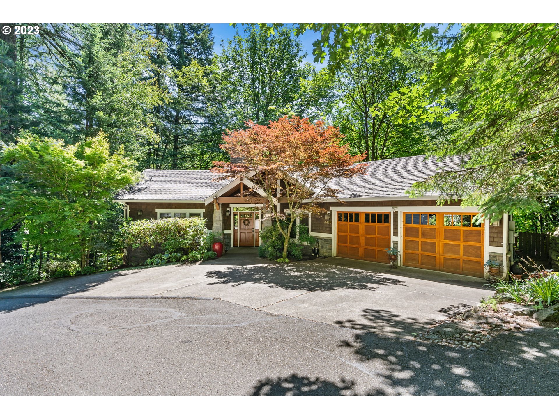 4410 West Burnside Road Portland, OR 97210 - Photo 1 of 42 a front view of a house with a garden