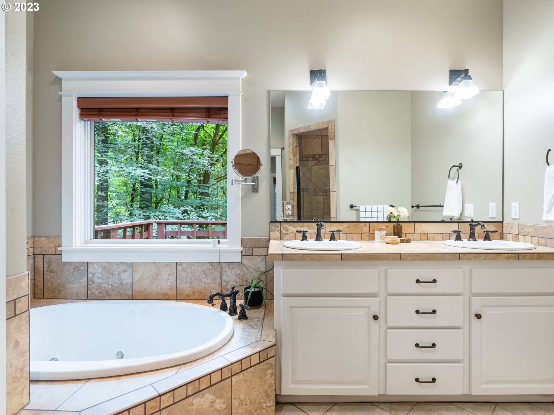 4410 West Burnside Road Portland, OR 97210 - Photo 18 of 42 a bathroom with a tub sink and mirror