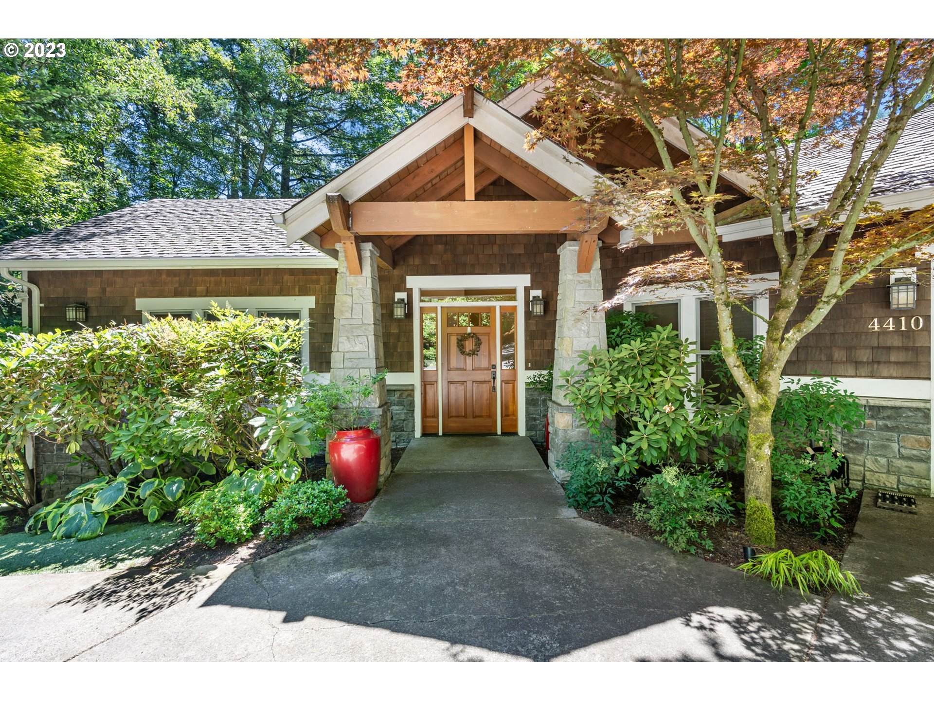 4410 West Burnside Road Portland, OR 97210 - Photo 2 of 42 a front view of a house with garden