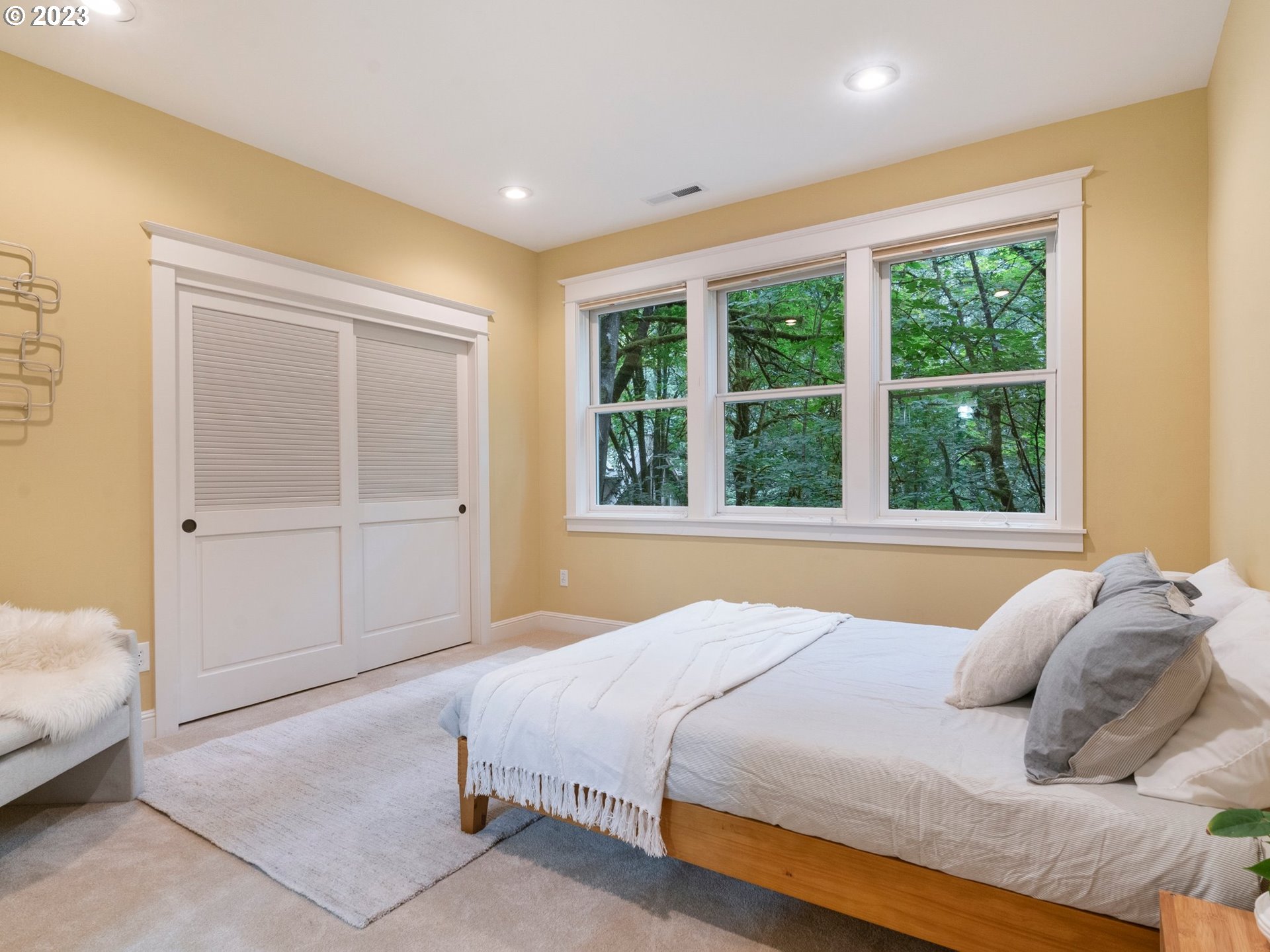 4410 West Burnside Road Portland, OR 97210 - Photo 23 of 42 a bedroom with a bed and a window