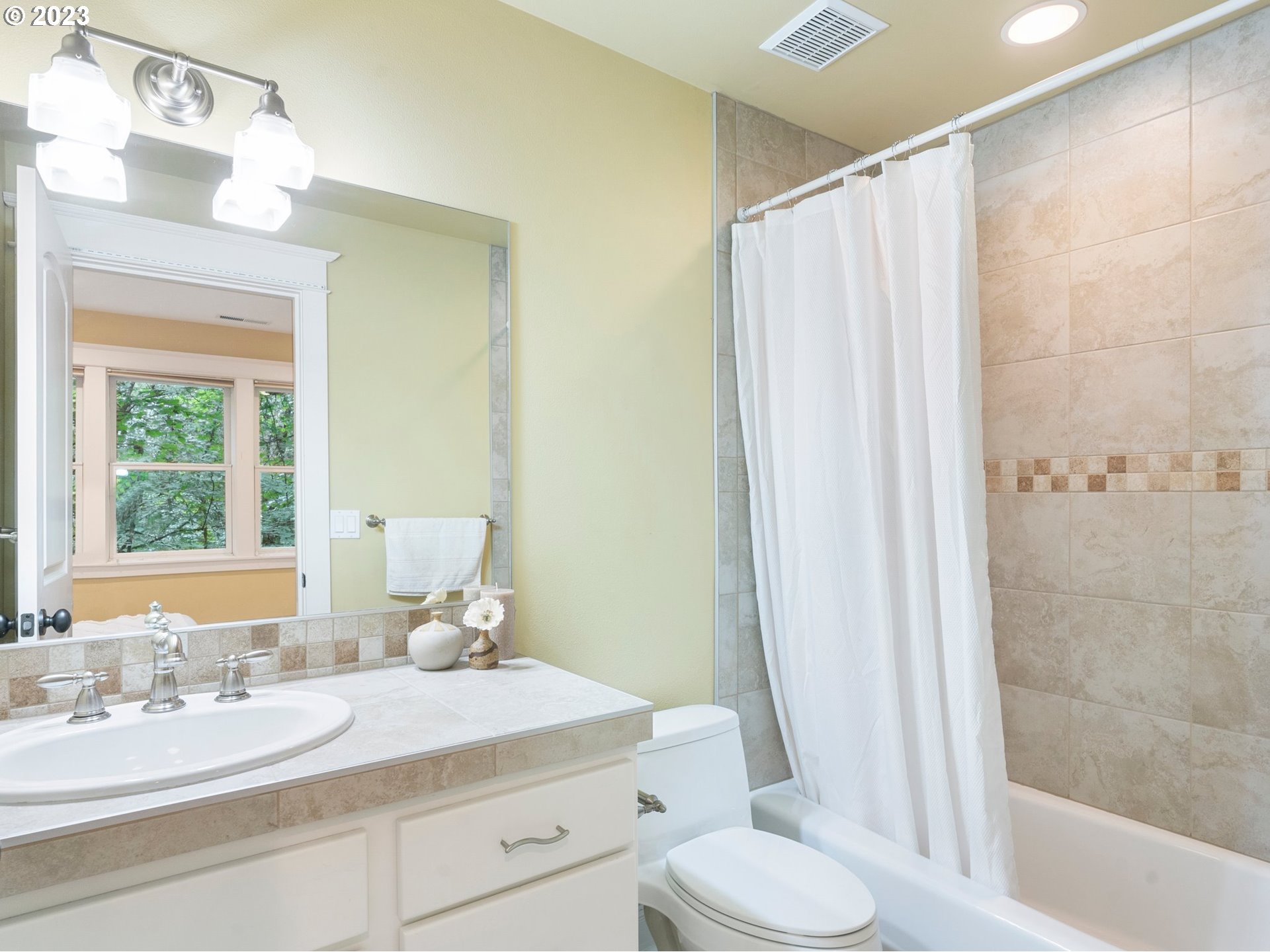 4410 West Burnside Road Portland, OR 97210 - Photo 25 of 42 a bathroom with a granite countertop sink toilet and shower