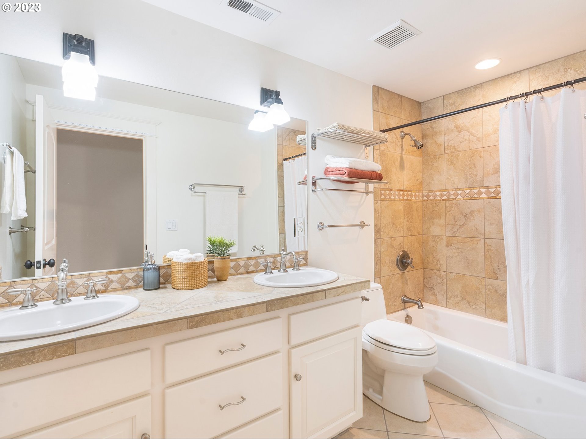 4410 West Burnside Road Portland, OR 97210 - Photo 29 of 42 a bathroom with a granite countertop sink a toilet and shower