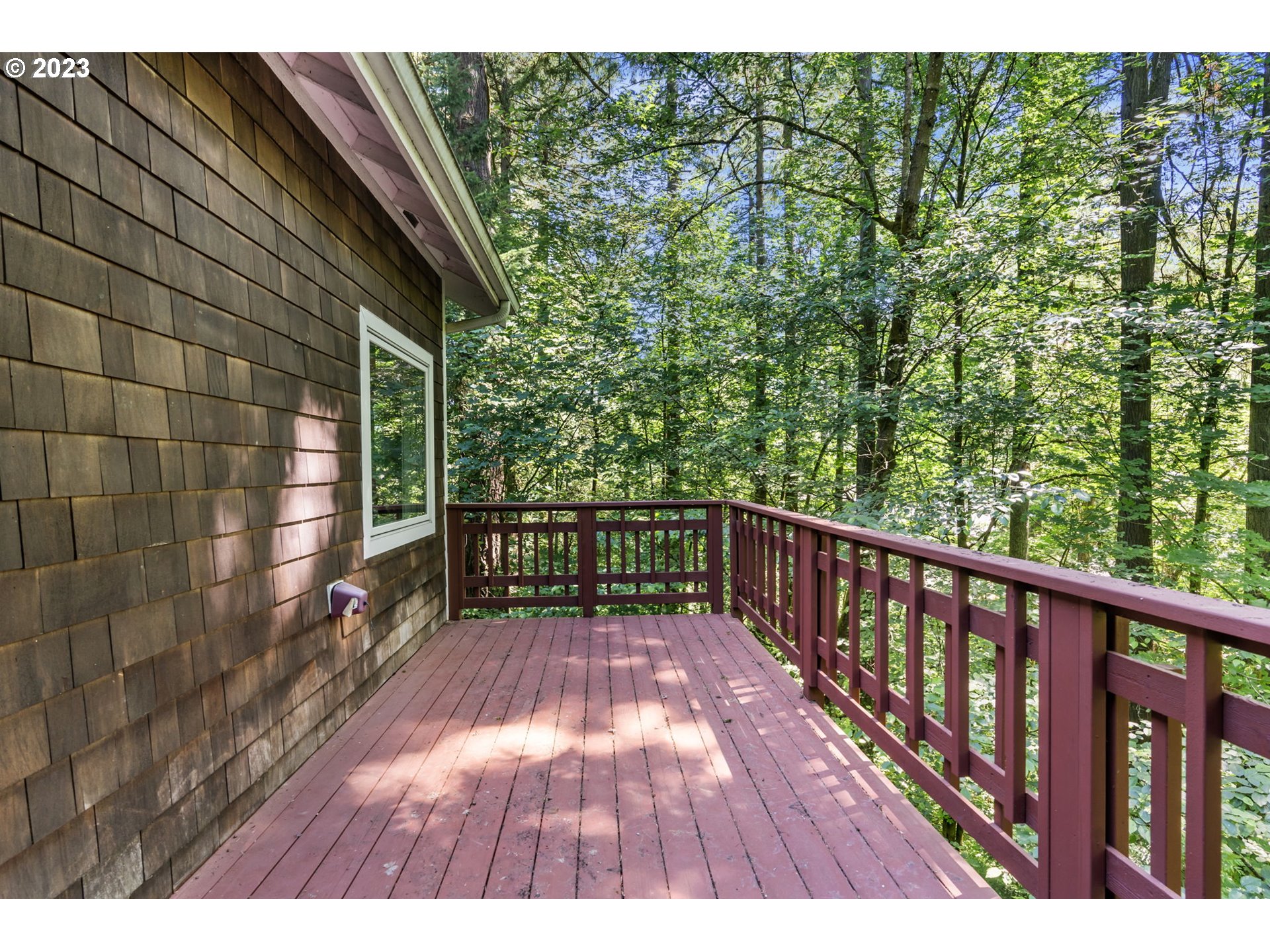 4410 West Burnside Road Portland, OR 97210 - Photo 30 of 42 a view of balcony with wooden floor and fence