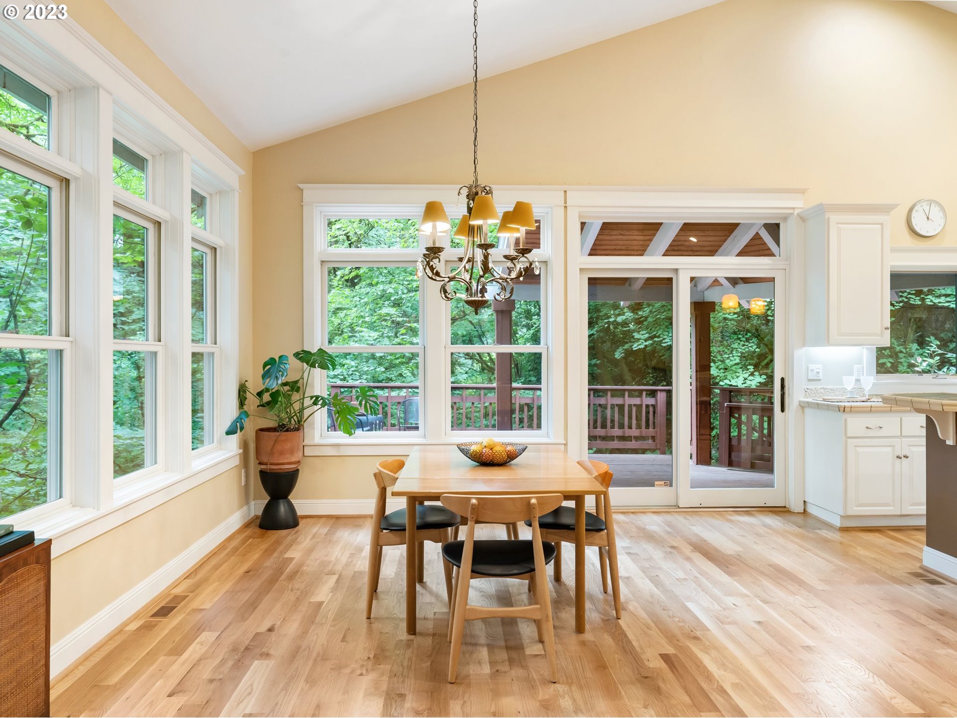 4410 West Burnside Road Portland, OR 97210 - Photo 9 of 42 a dining room with furniture window and wooden floor