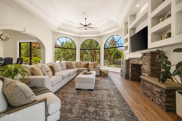 a living room with fireplace furniture and a flat screen tv