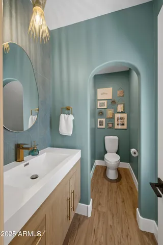 a kitchen with granite countertop a sink a stove and cabinets
