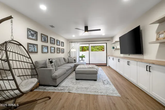 a bathroom with a sink mirror and toilet