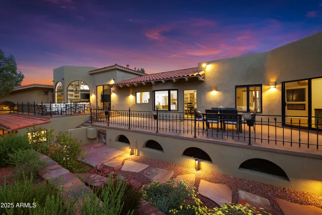 a view of a swimming pool with an outdoor seating