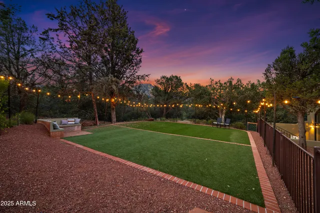 a outdoor living space with furniture and a fireplace