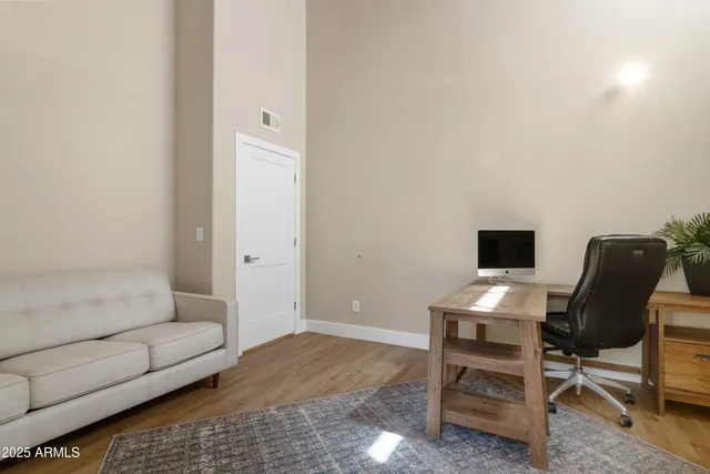 a bathroom with a granite countertop sink a toilet and shower