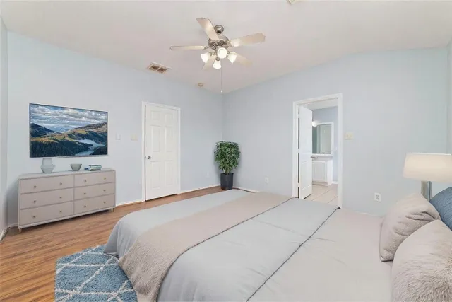 a bedroom with a bed and a dresser