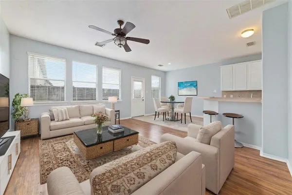 a living room with furniture and a large window