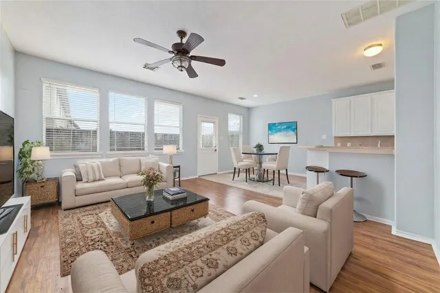 a living room with furniture and a large window